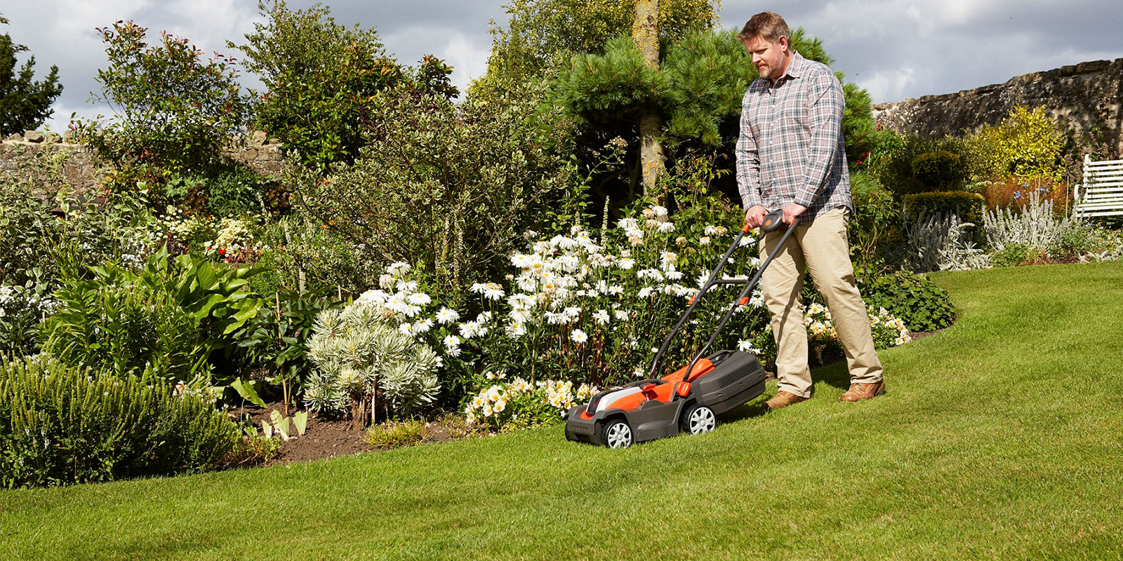 Flymo man mowing lawn Flymo man mowing lawn