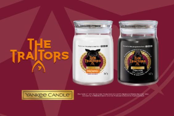 The Traitors branded candles - a white one and a black one