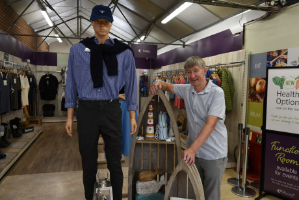 GCA chief Peter Banks standing beside a mannequin in a garden centre
