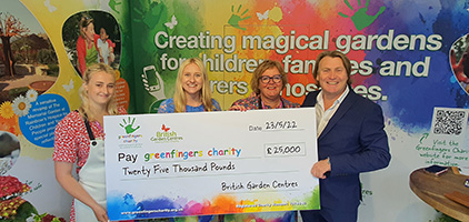 Abigail Stubbs, Amy Stubbs, Linda Petrons, David Domoney with the Greenfingers Charity cheque from British Garden Centres fund raining