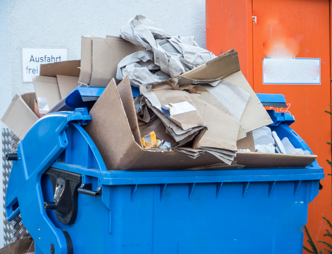 Carboard boxes in a commercial bin