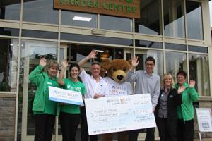 Martin House and Tong Garden Centre staff celebrating the donation