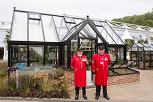 Chelsea Pensioners in front of Opus Grand Botanic Hartley Botanic Greenhouse press day